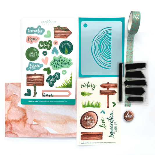 Christian journaling craft kit inspired by Easter and Spring featuring soft green, blush, and wood elements. Stamps, stencil, and stickers are perfect for Bible journaling and devotional art.